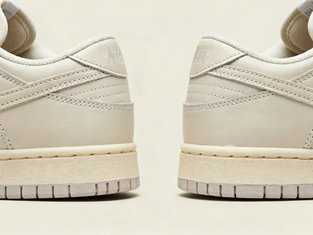 Detale starannego wykończenia i szwów w sneakersach